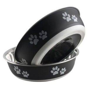 Two black pet bowls with white paw prints stacked together.