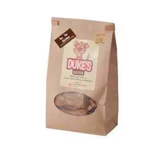 Brown paper bag of Dukes natural dog treats with a clear window.