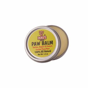 A small tin of natural paw balm for dogs and cats.